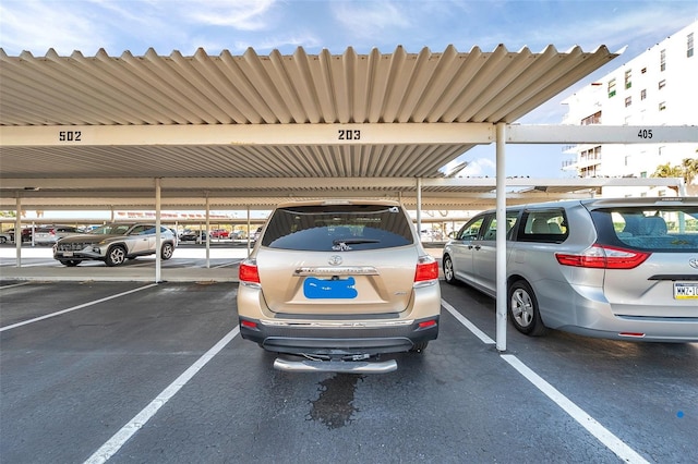 view of vehicle parking featuring a carport