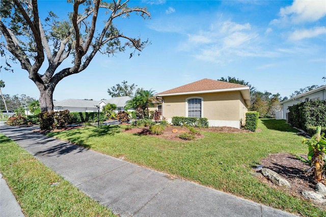 view of side of home with a yard