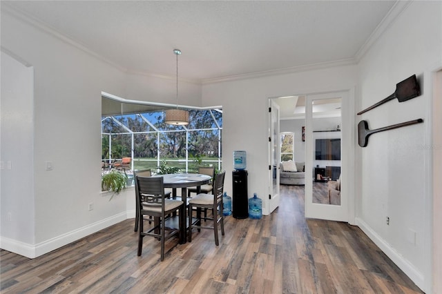 dining room featuring crown molding and dark hardwood / wood-style floors