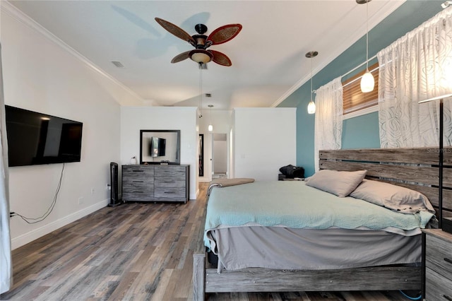 bedroom with dark hardwood / wood-style flooring, ceiling fan, and crown molding