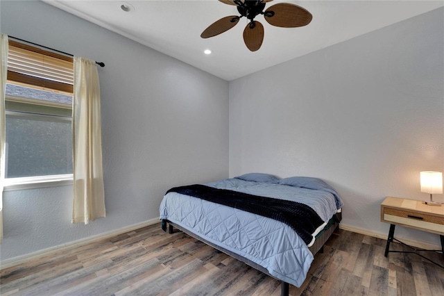 bedroom featuring ceiling fan and wood-type flooring