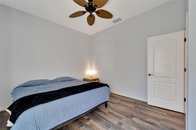 bedroom with hardwood / wood-style flooring and ceiling fan