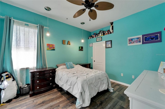 bedroom featuring ceiling fan and dark wood-type flooring