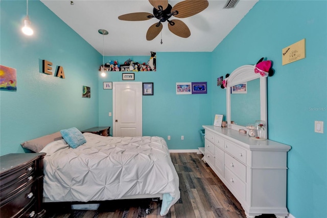 bedroom with dark hardwood / wood-style floors and ceiling fan