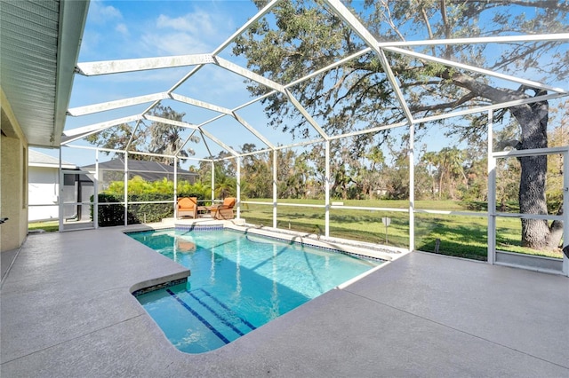 view of swimming pool with a lanai and a patio