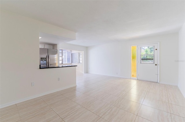 spare room with light tile patterned flooring