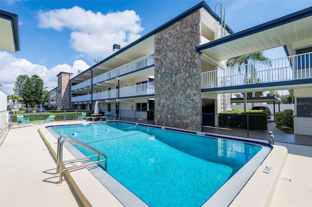 view of swimming pool with a patio