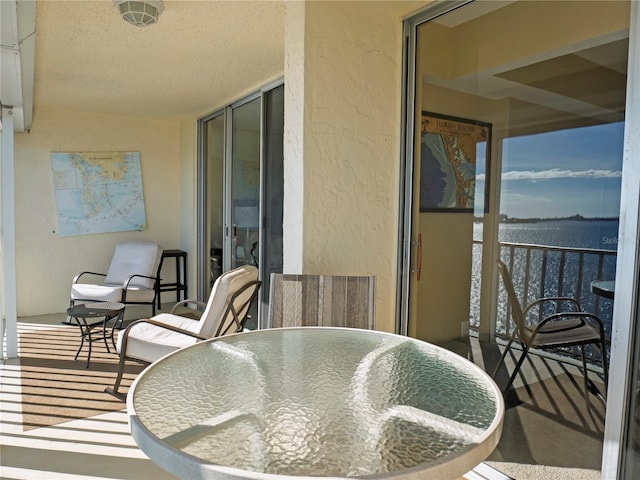 balcony featuring a water view