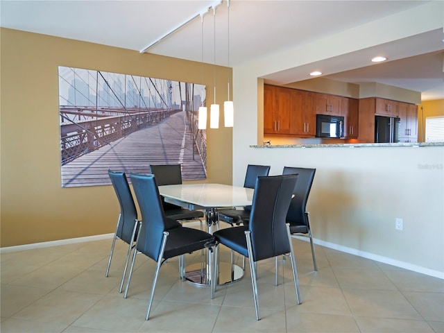 dining room with light tile patterned floors