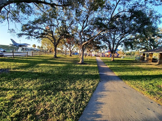 surrounding community featuring a lawn