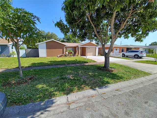 single story home featuring a garage and a front yard