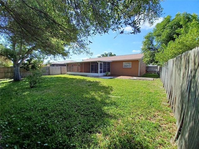 view of yard featuring a sunroom