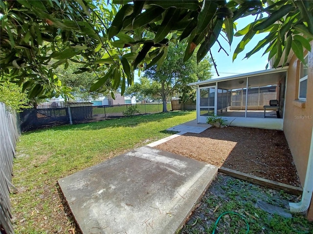 view of yard with a patio and a sunroom