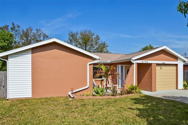 view of front facade featuring a garage and a front yard