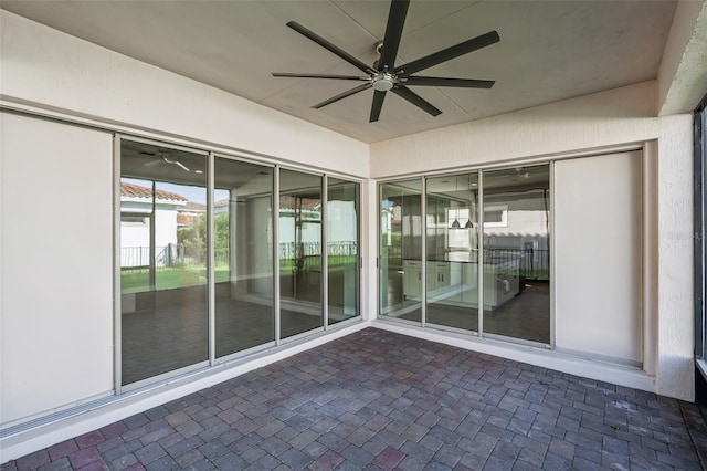 view of patio featuring ceiling fan