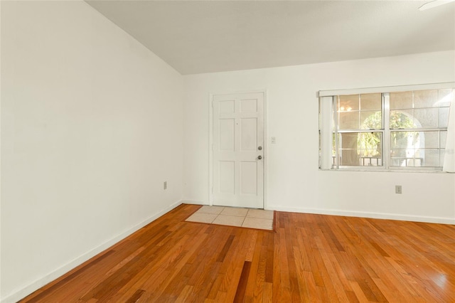 entryway with hardwood / wood-style flooring