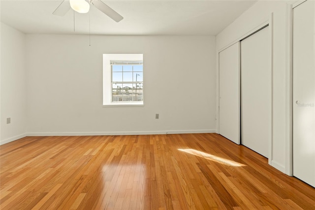 unfurnished bedroom featuring ceiling fan and light hardwood / wood-style floors