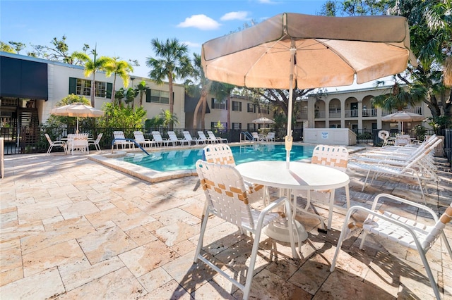 view of swimming pool with a patio