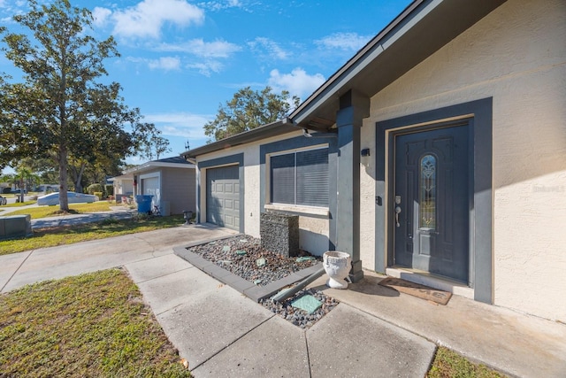 doorway to property featuring a garage