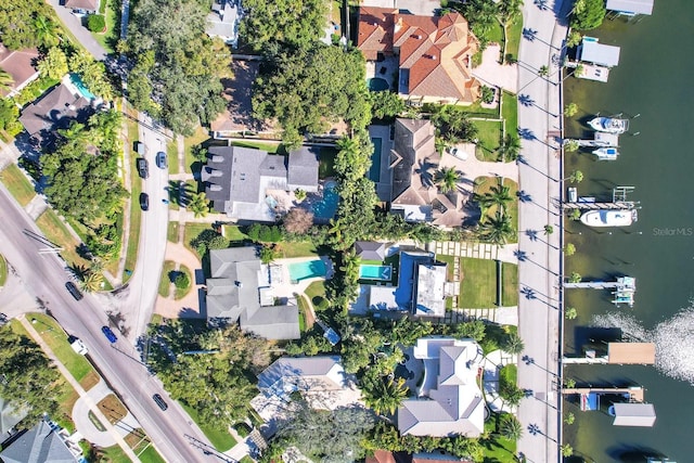 birds eye view of property featuring a water view