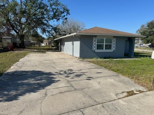 view of side of home featuring a yard