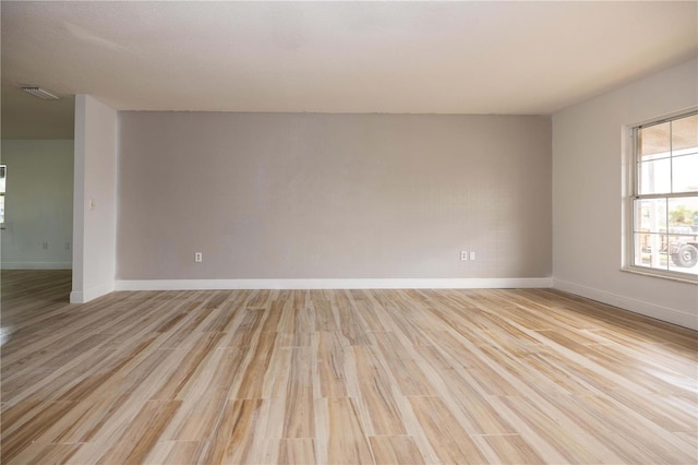 empty room with light hardwood / wood-style floors