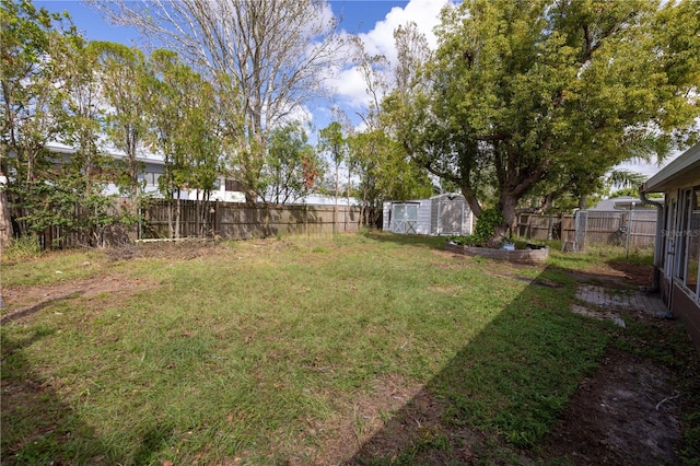 view of yard with a storage shed