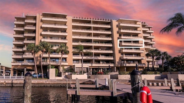 outdoor building at dusk featuring a water view