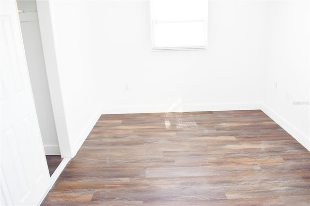 empty room featuring wood-type flooring