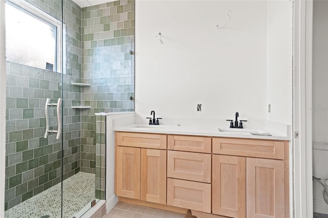 bathroom featuring vanity, tile patterned floors, toilet, and walk in shower