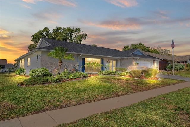 single story home featuring a yard