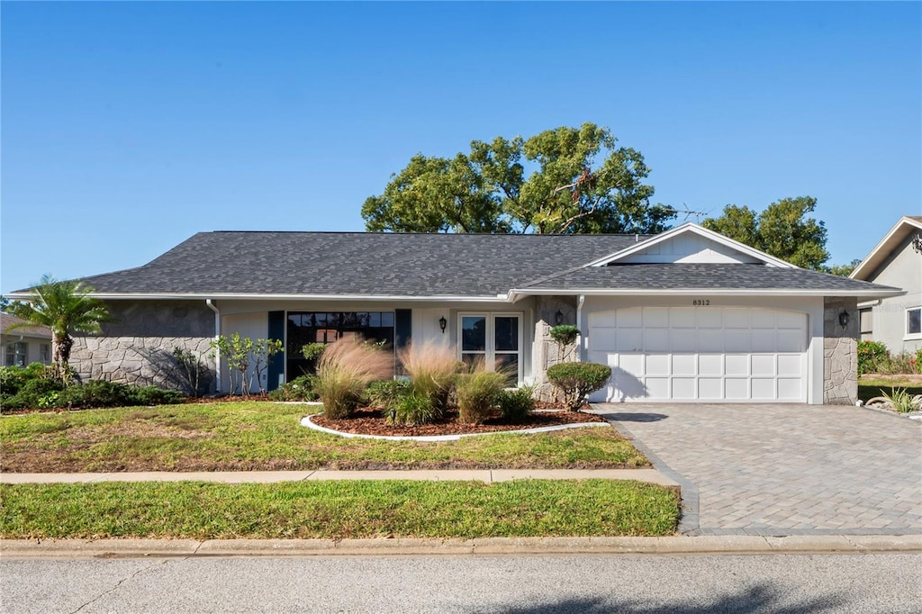 ranch-style home with a garage