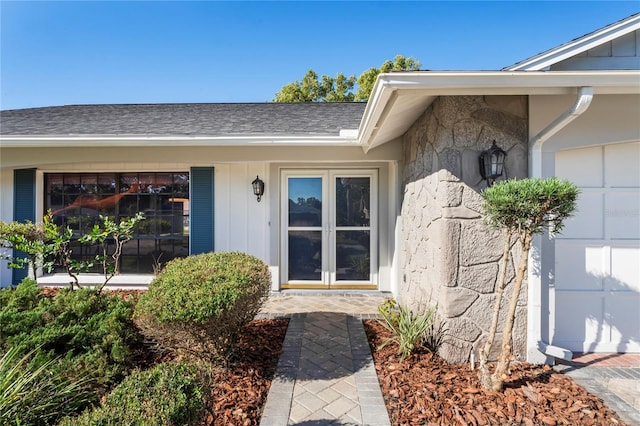 doorway to property with a garage