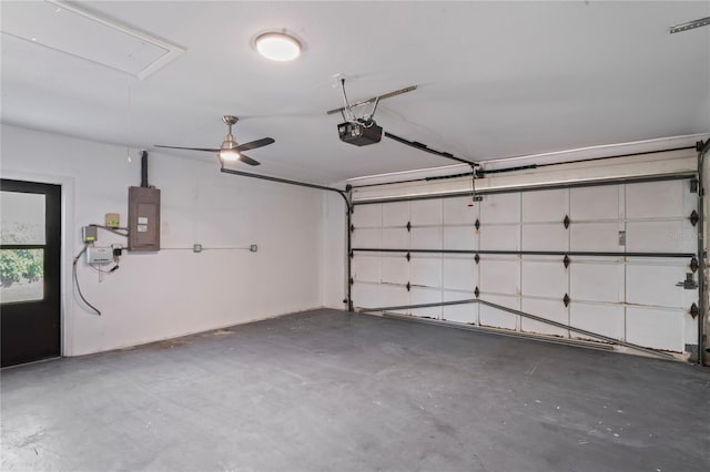 garage featuring a garage door opener and electric panel