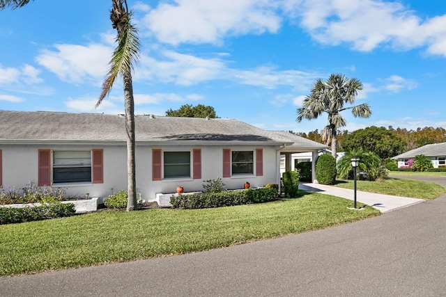 single story home with a front yard