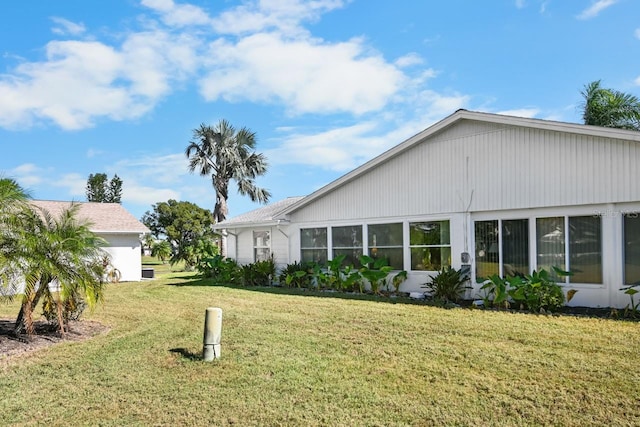 view of home's exterior featuring a lawn