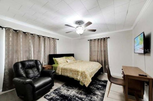 bedroom featuring wood-type flooring, ceiling fan, and ornamental molding