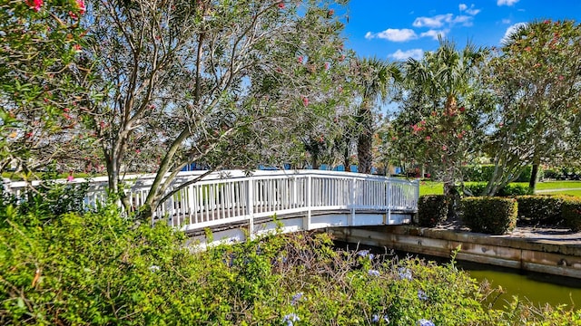 back of house featuring a deck with water view