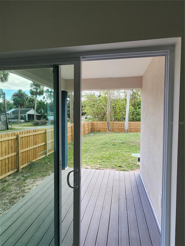 doorway to outside featuring hardwood / wood-style flooring and plenty of natural light