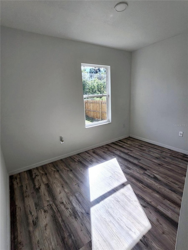 5714 Olive Dr, New Port Richey, FL 34652 - spare room featuring wood finished floors and baseboards