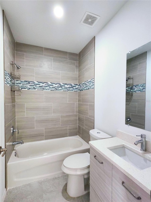 bathroom featuring toilet, visible vents, shower / washtub combination, and vanity