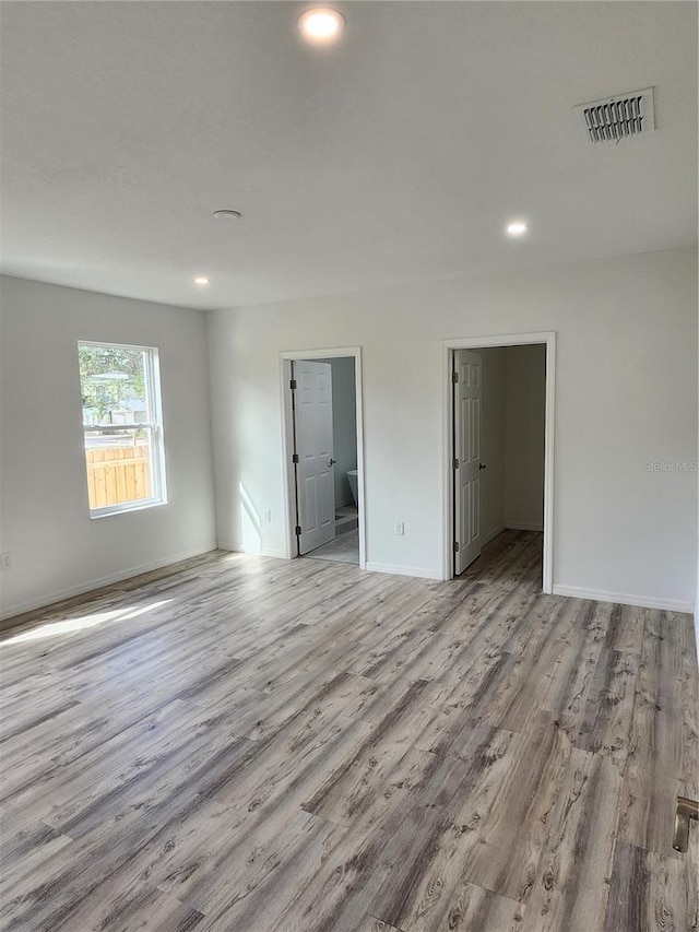 5714 Olive Dr, New Port Richey, FL 34652 - spare room featuring wood finished floors, recessed lighting, and baseboards