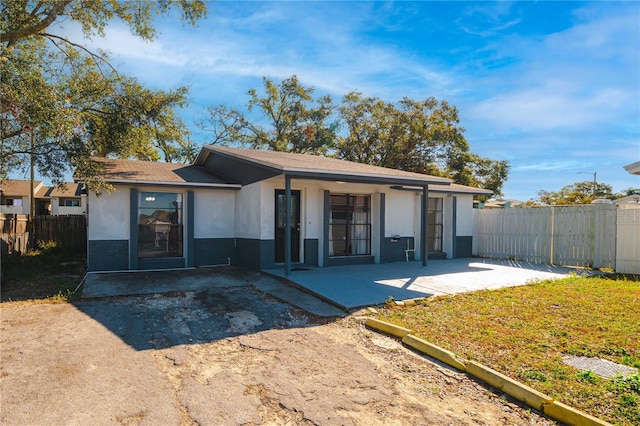 back of house with a patio area