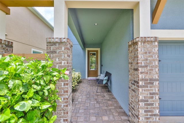 view of exterior entry featuring a garage