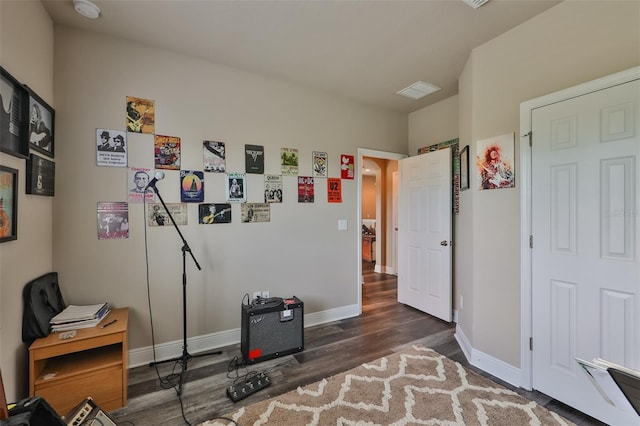 misc room with dark wood-type flooring