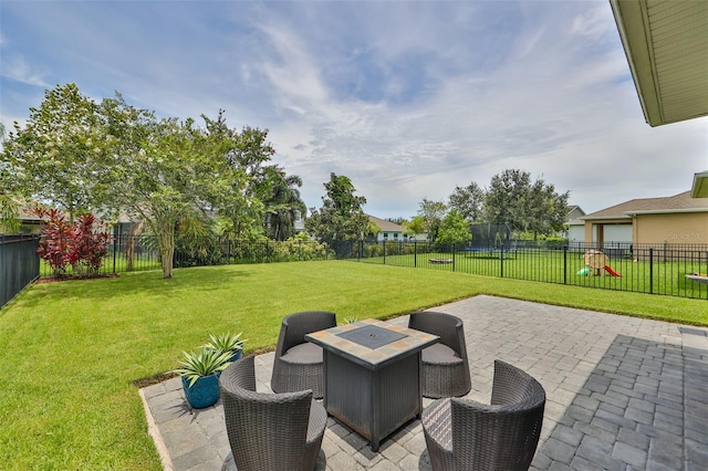 view of patio with an outdoor fire pit