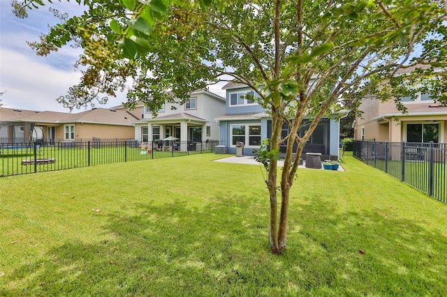 rear view of property featuring a lawn