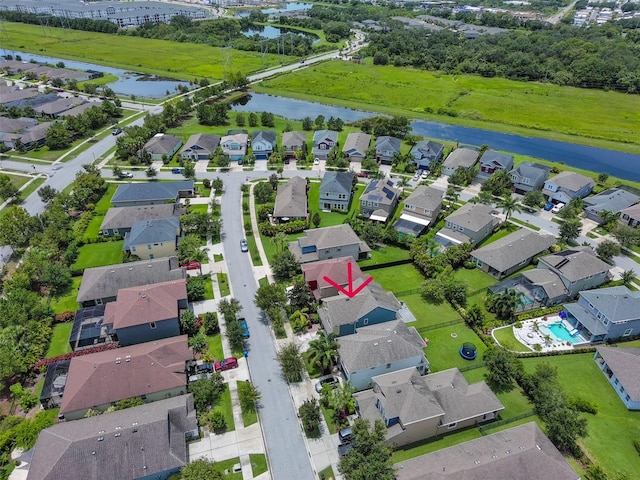 birds eye view of property with a water view