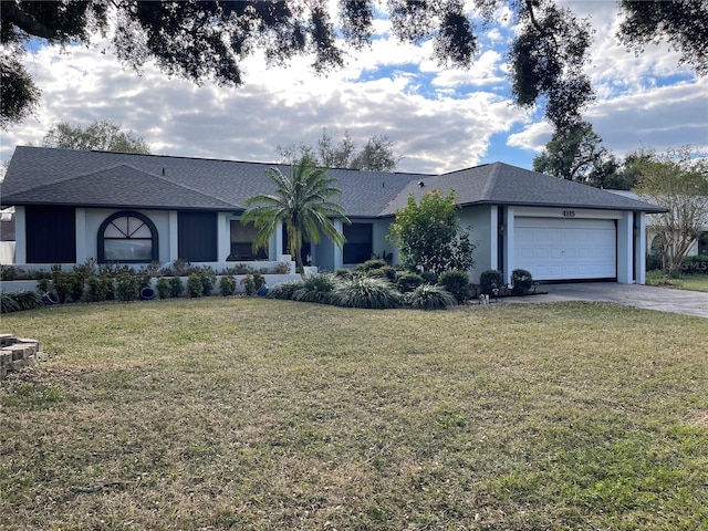 ranch-style house with a garage and a front lawn