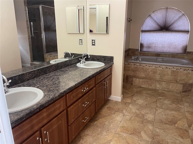 bathroom featuring vanity and separate shower and tub